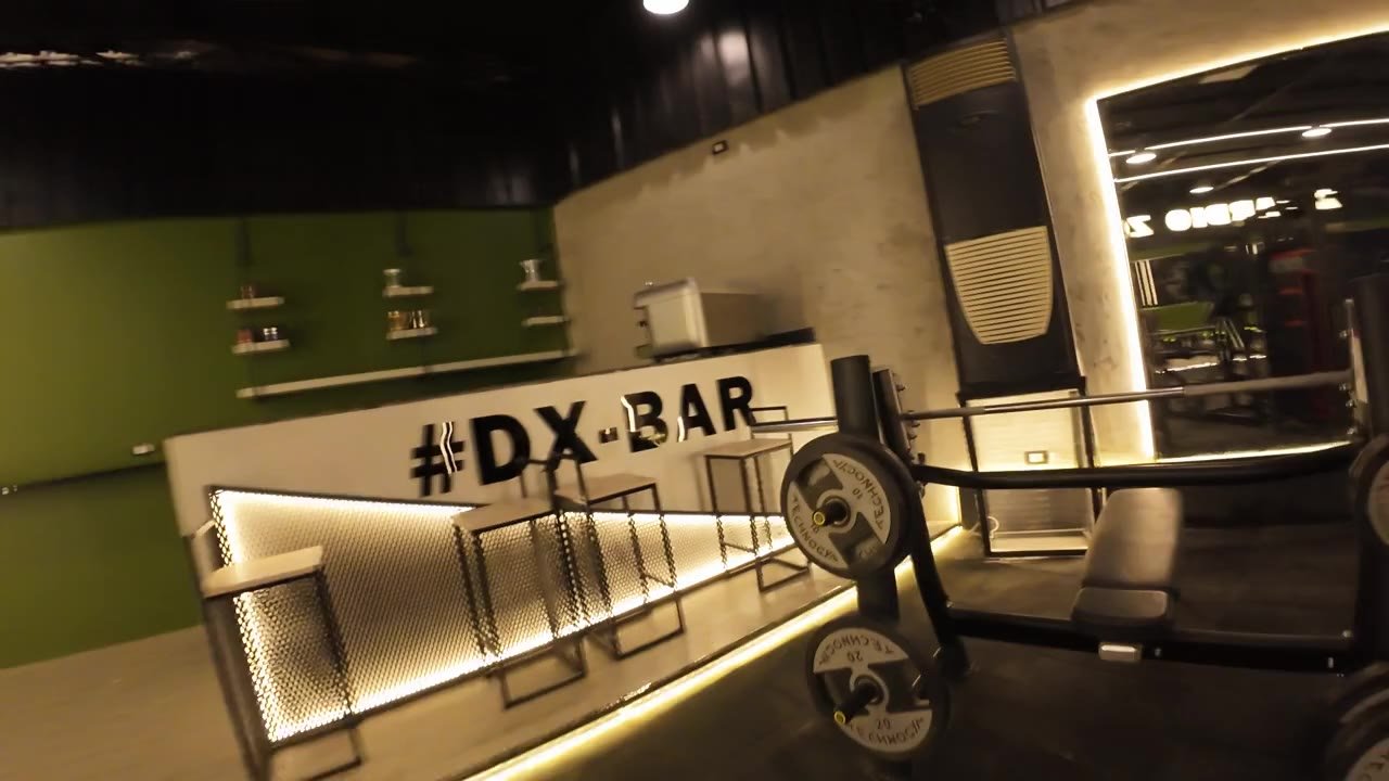 The DX Bar area with barbells in the foreground.